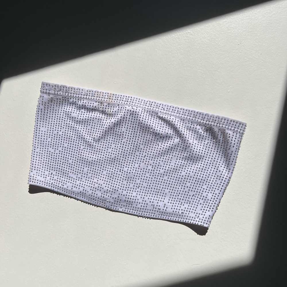White cropped tube top with silver beads on it.